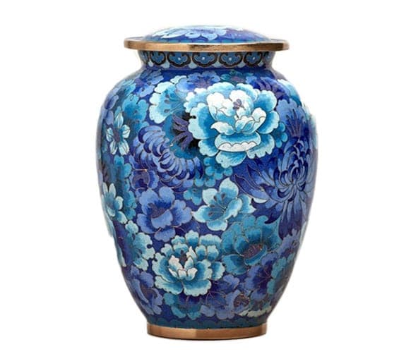 A blue floral cloisonne urn with brass lid and base