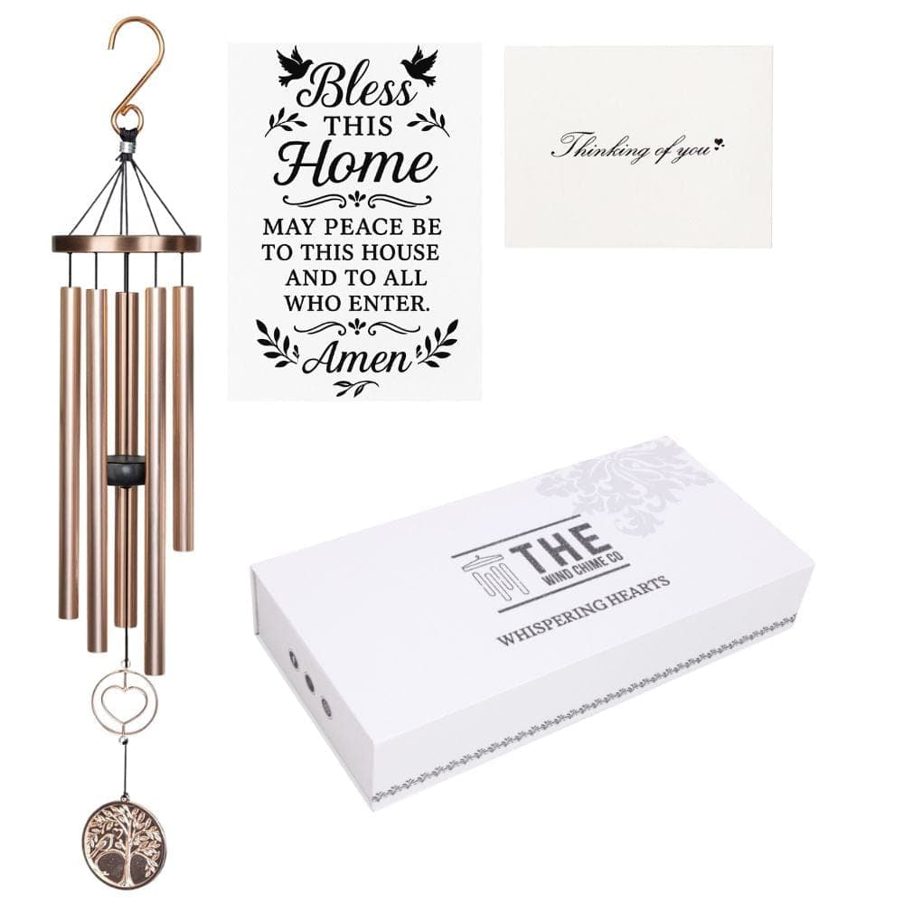 A rose gold memorial wind chime with heart charm, remembrance cards, and gift box
